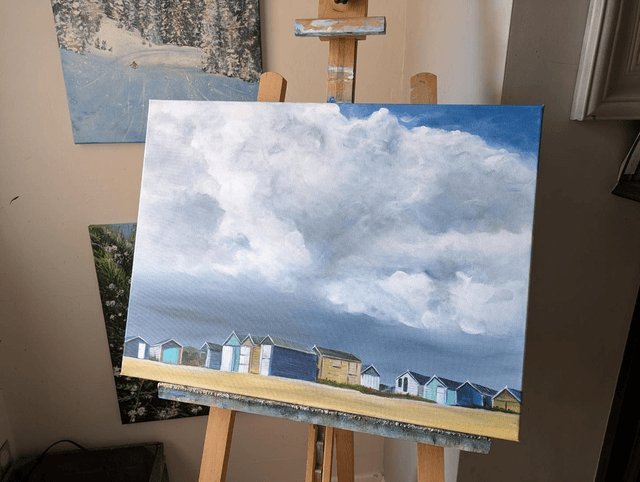 Storm clouds over Hayling Island beach huts
